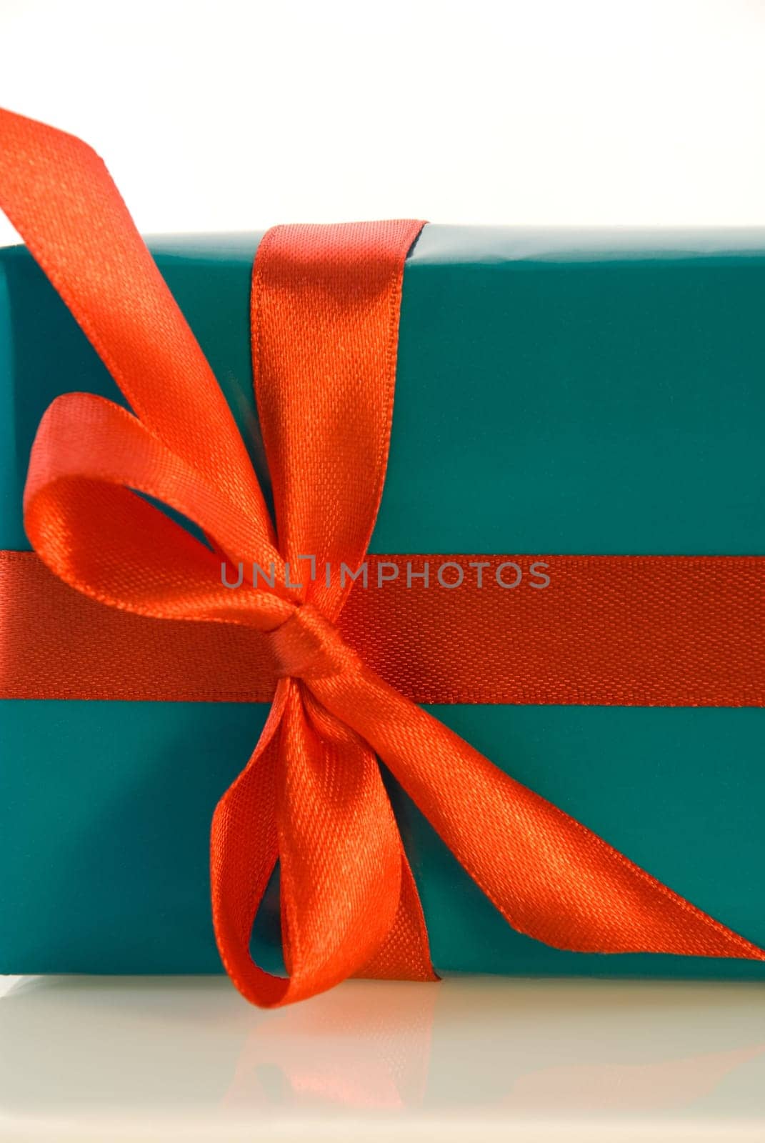 cutout of a blue gift with red bow