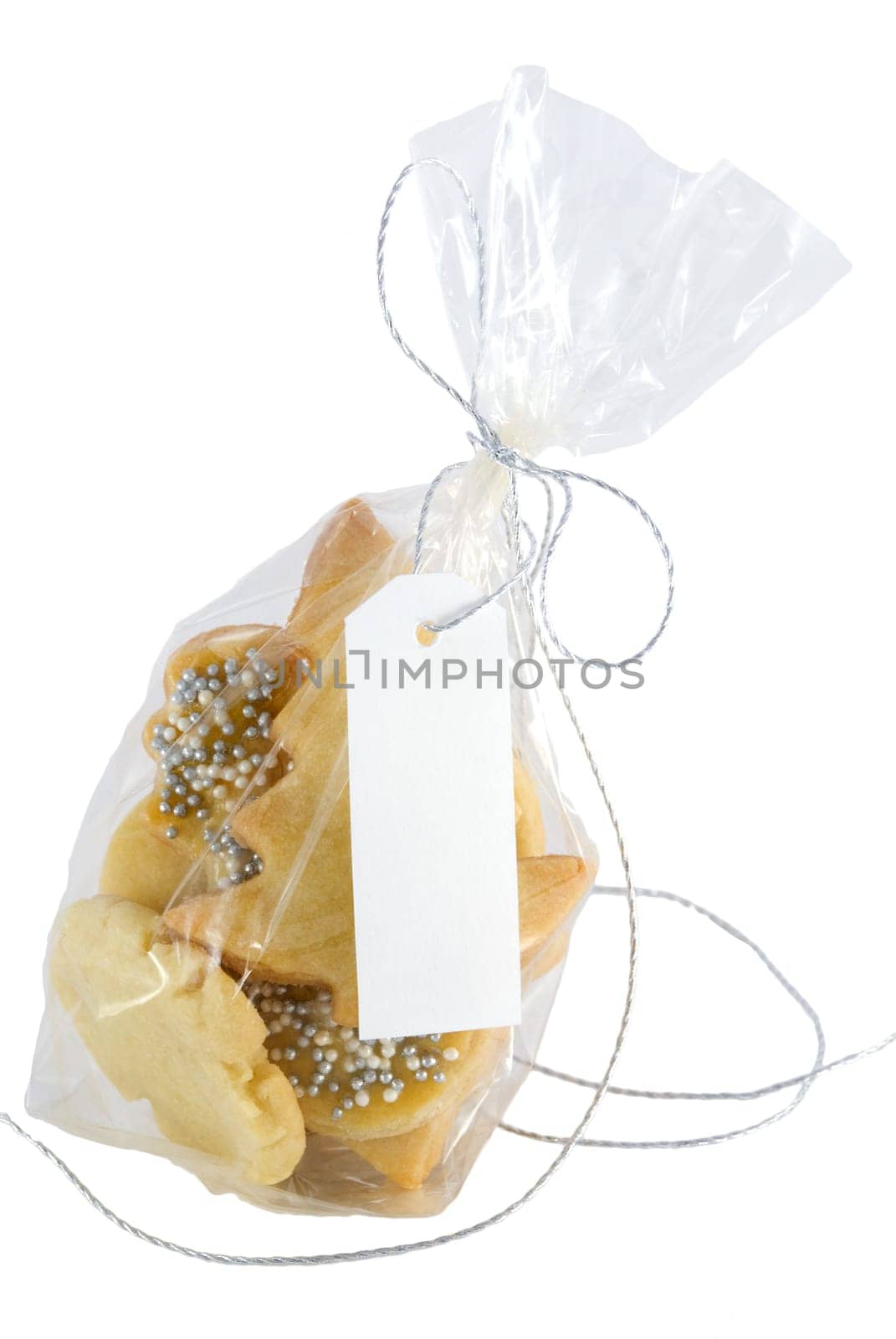 bag full of home-baked christmas cookies with white label, isolated