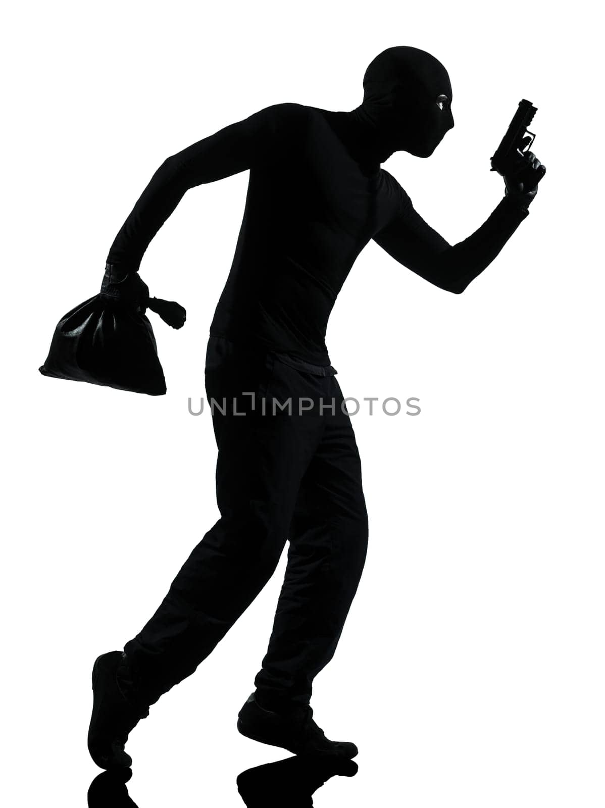 thief criminal holding gun in silhouette studio isolated on white background