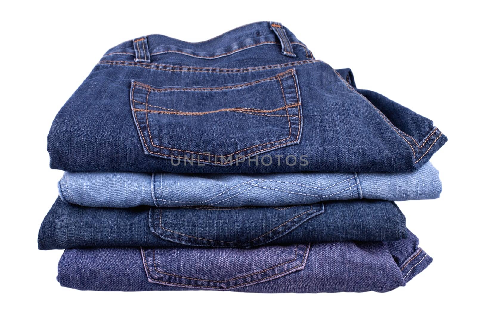 Stack of jeans isolated on white background.