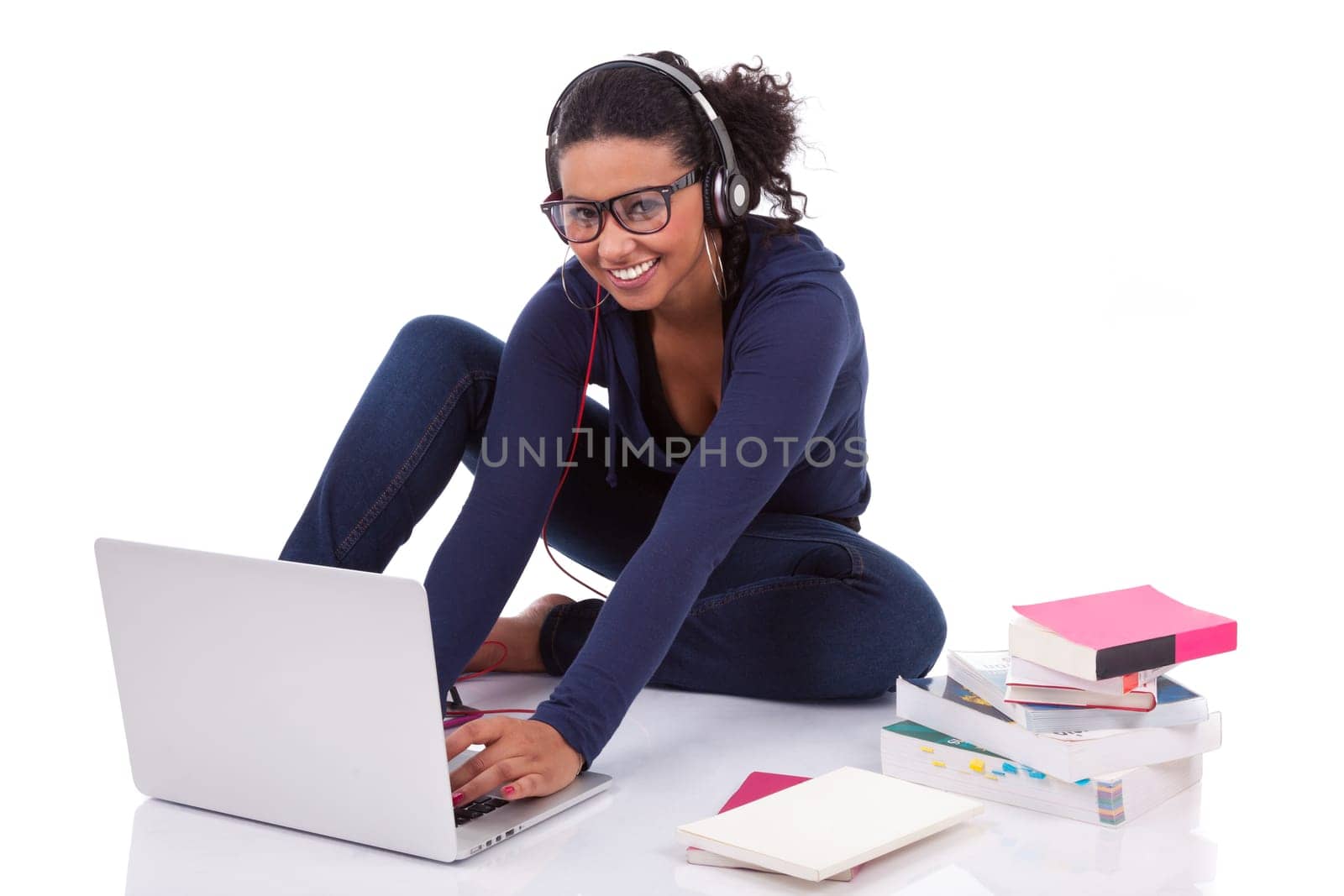 Young African student girl using a computer, isolated on white background