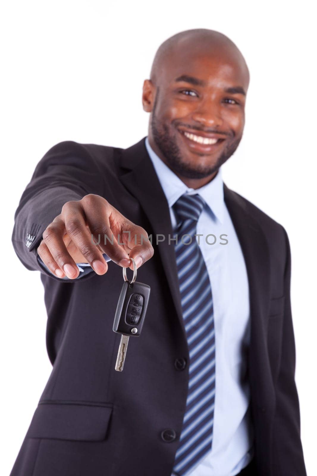 Young African American businessman holding a car key,isolated on white background