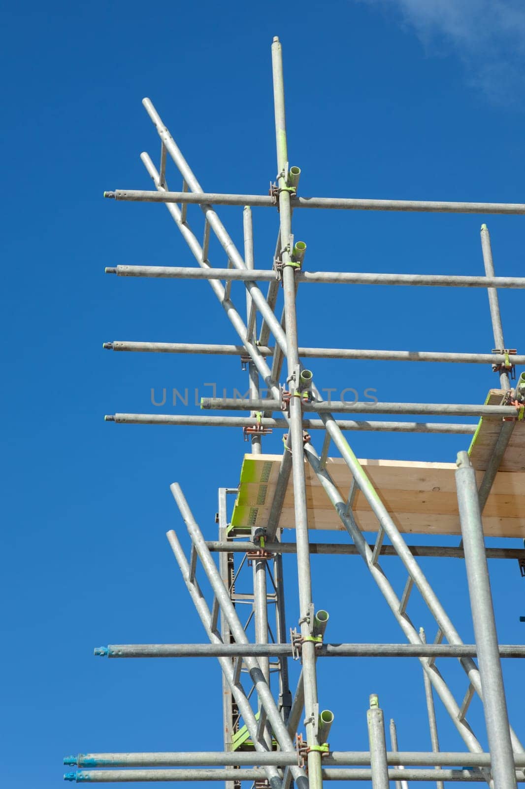 scaffolding construction in building industry with  blue sky