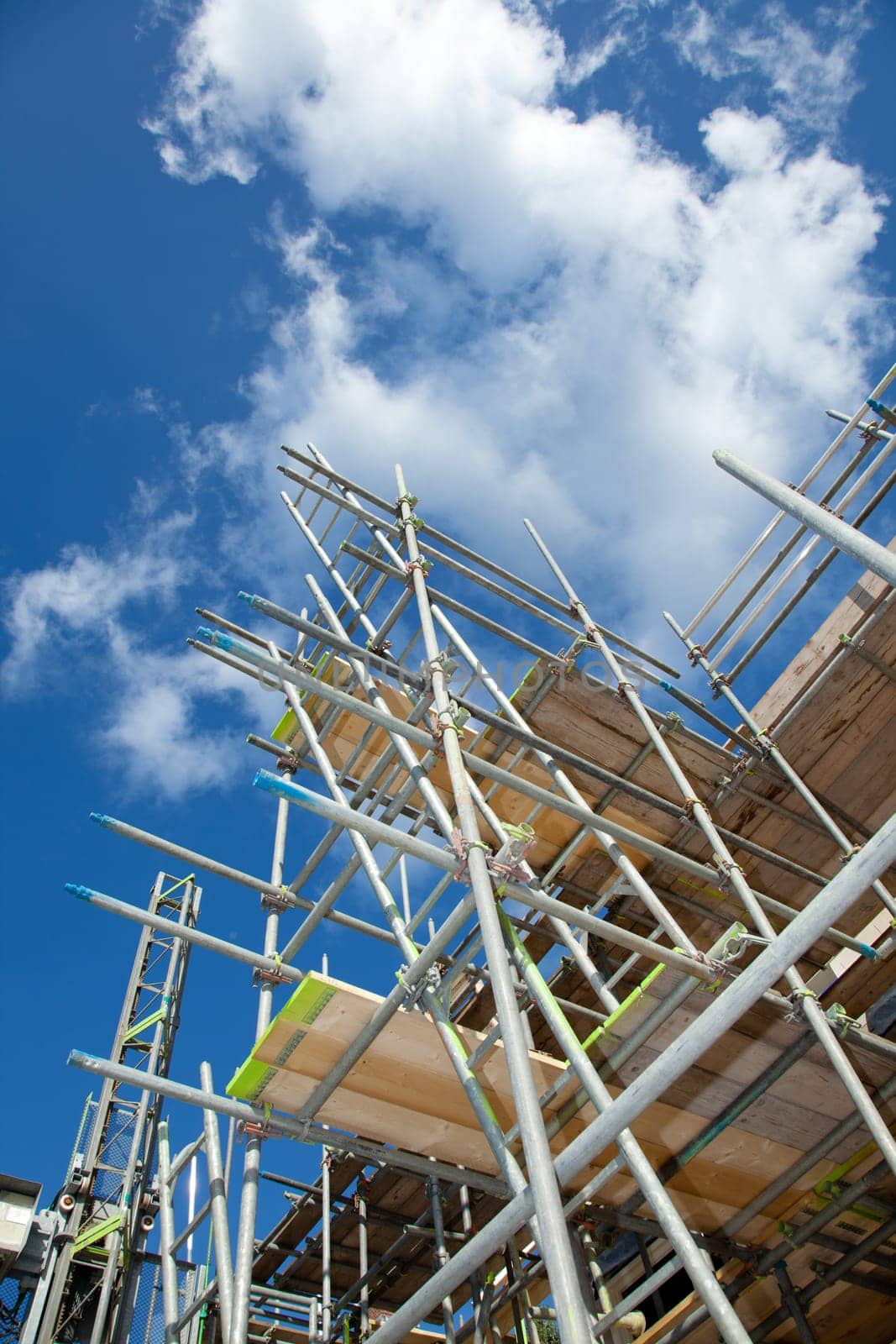 scaffolding construction in building industry with  blue sky