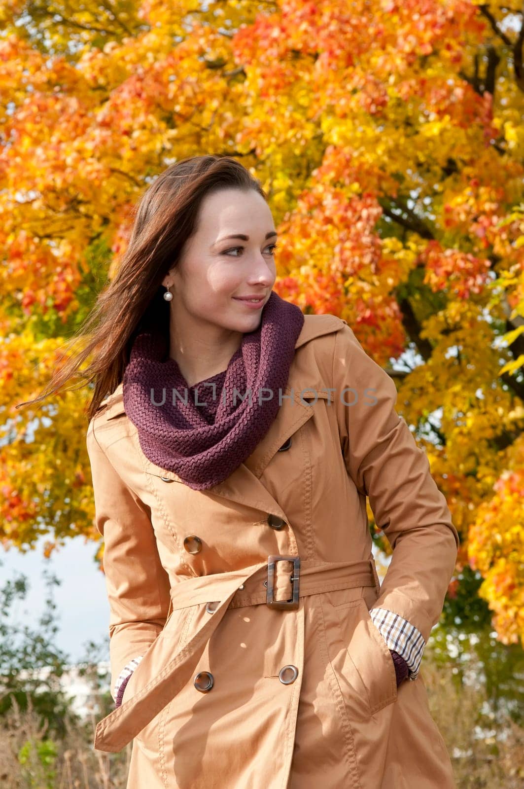 Young woman in autumnal park