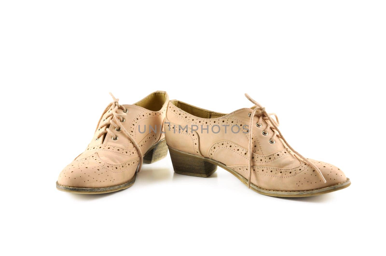 Pair of woman shoes on white background