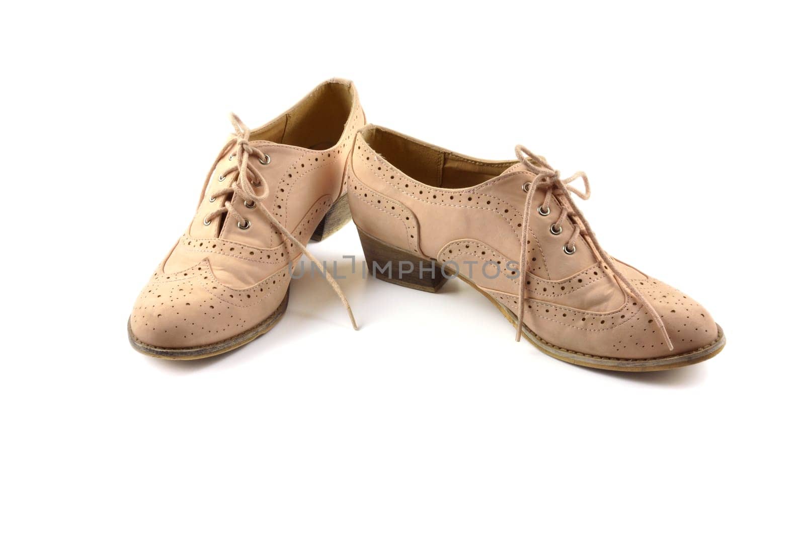 Pair of woman shoes on white background