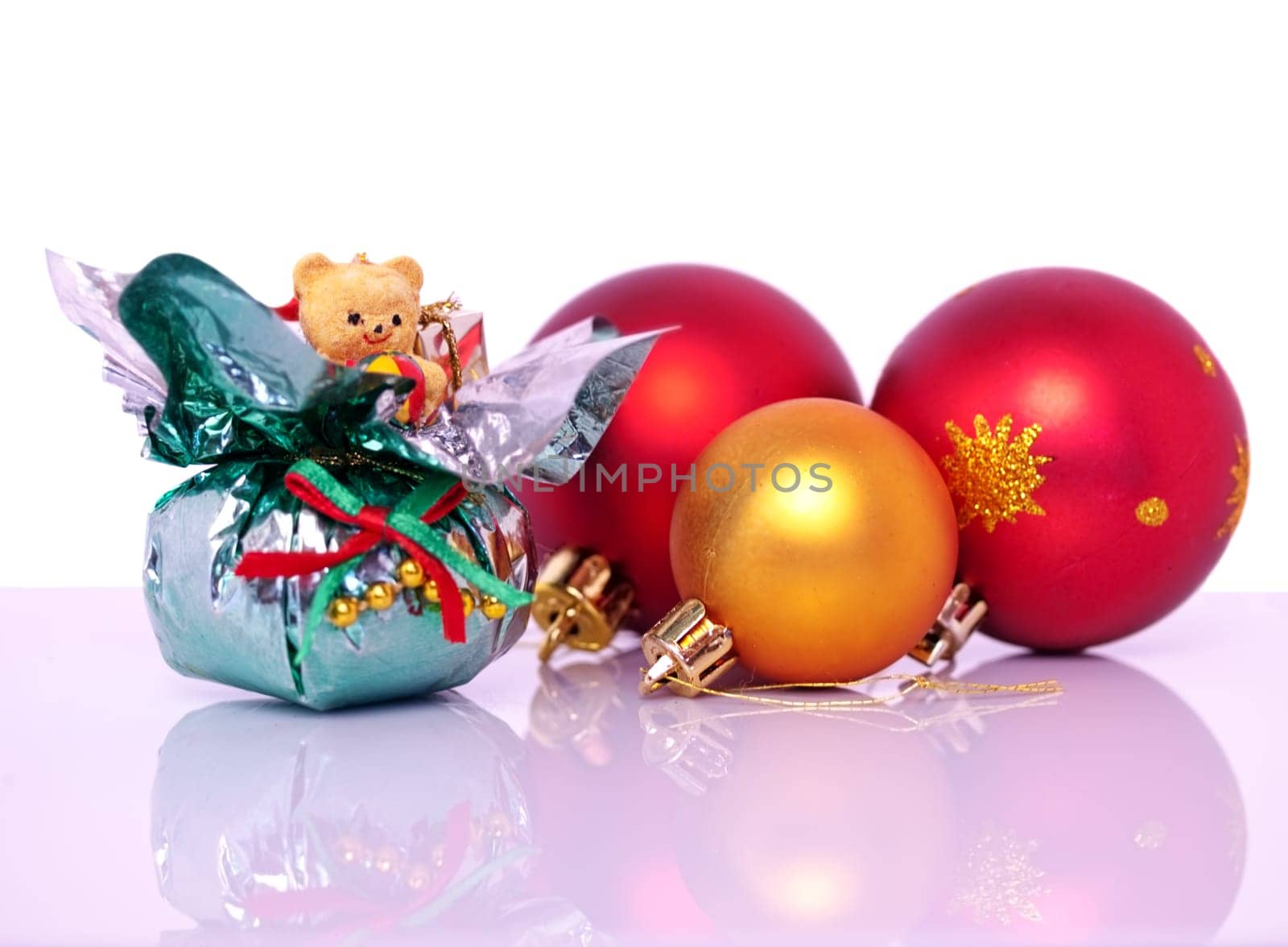 Christmas decorations and baubles at xmas with white and reflection