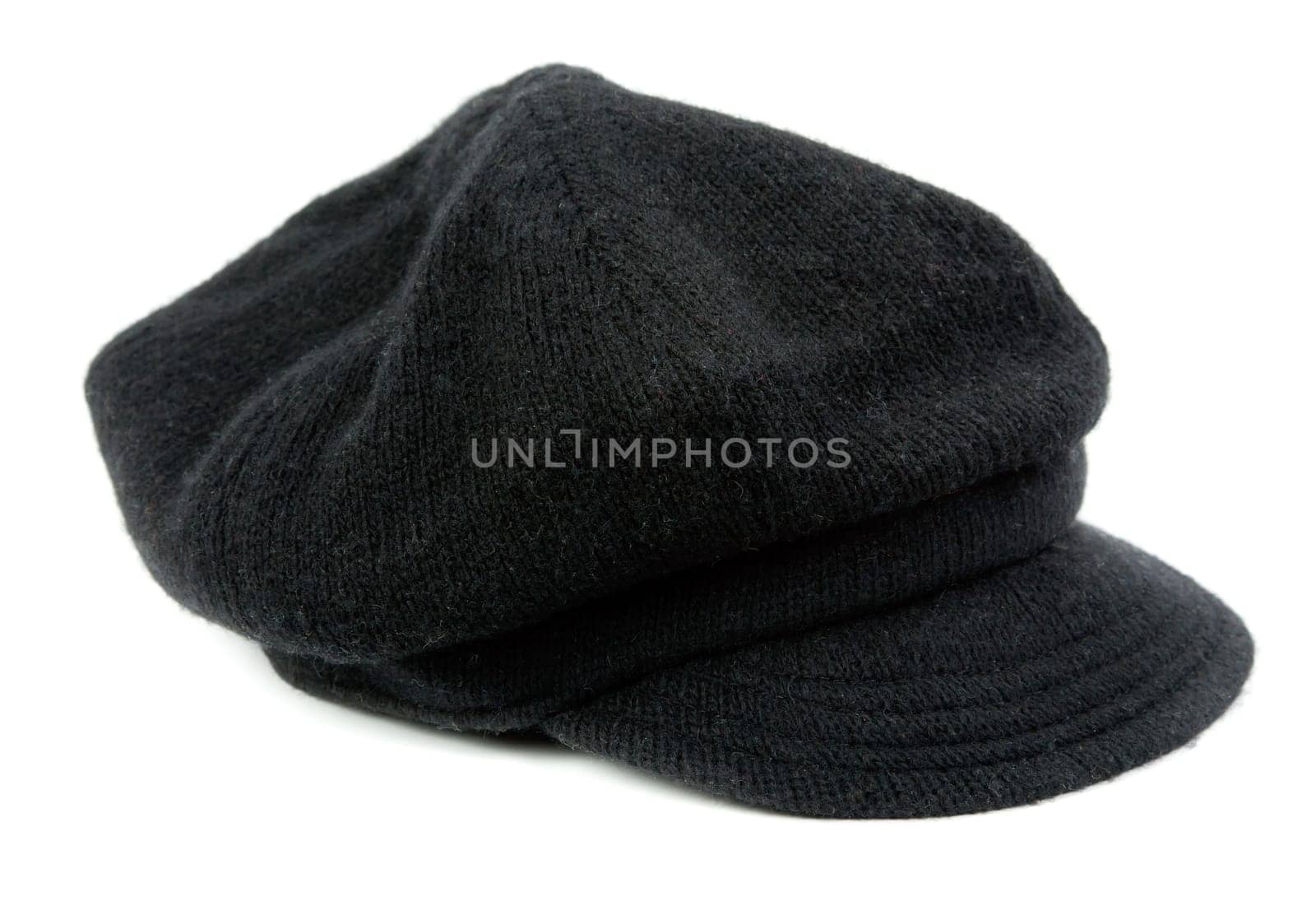 Warm black women's cap in the studio on a white background