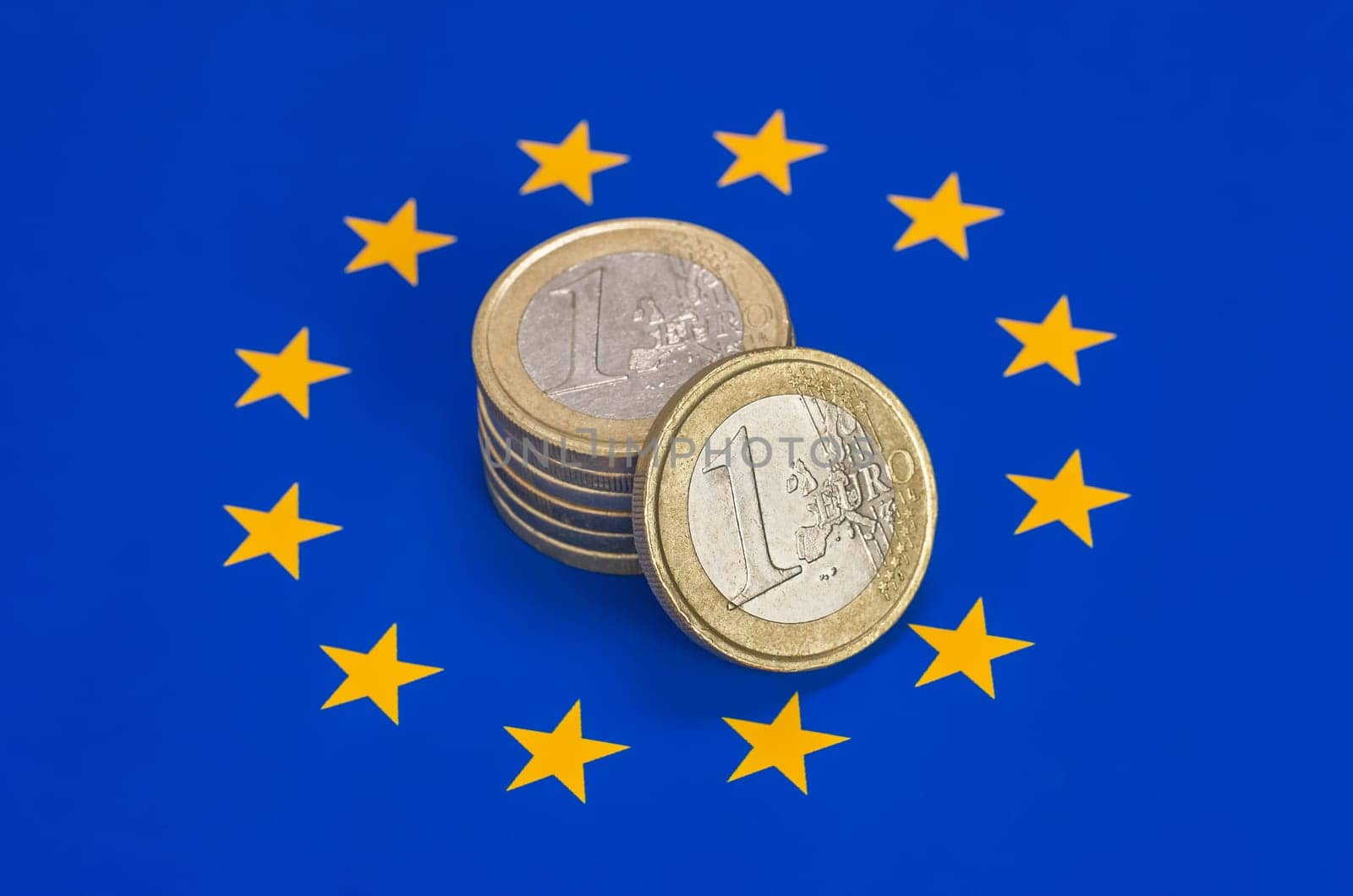 Euro coins on the EU flag