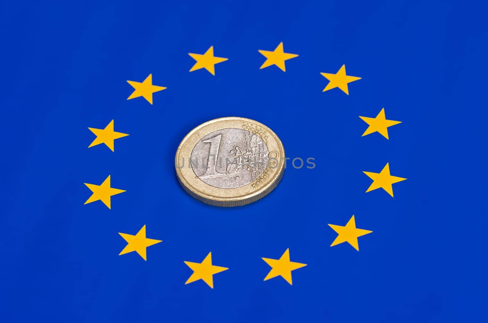 Euro coin on the EU flag