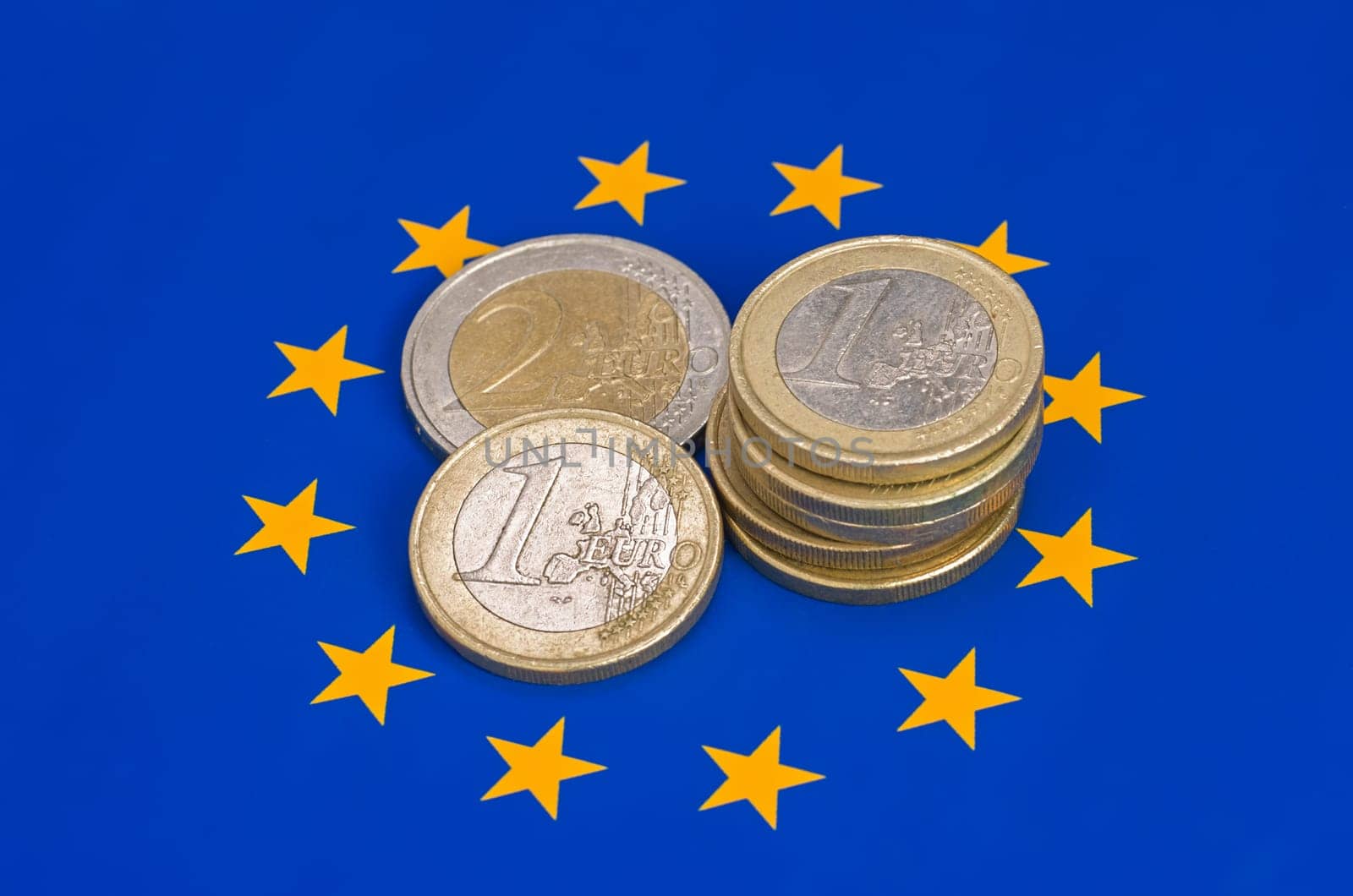 Euro coins on the EU flag
