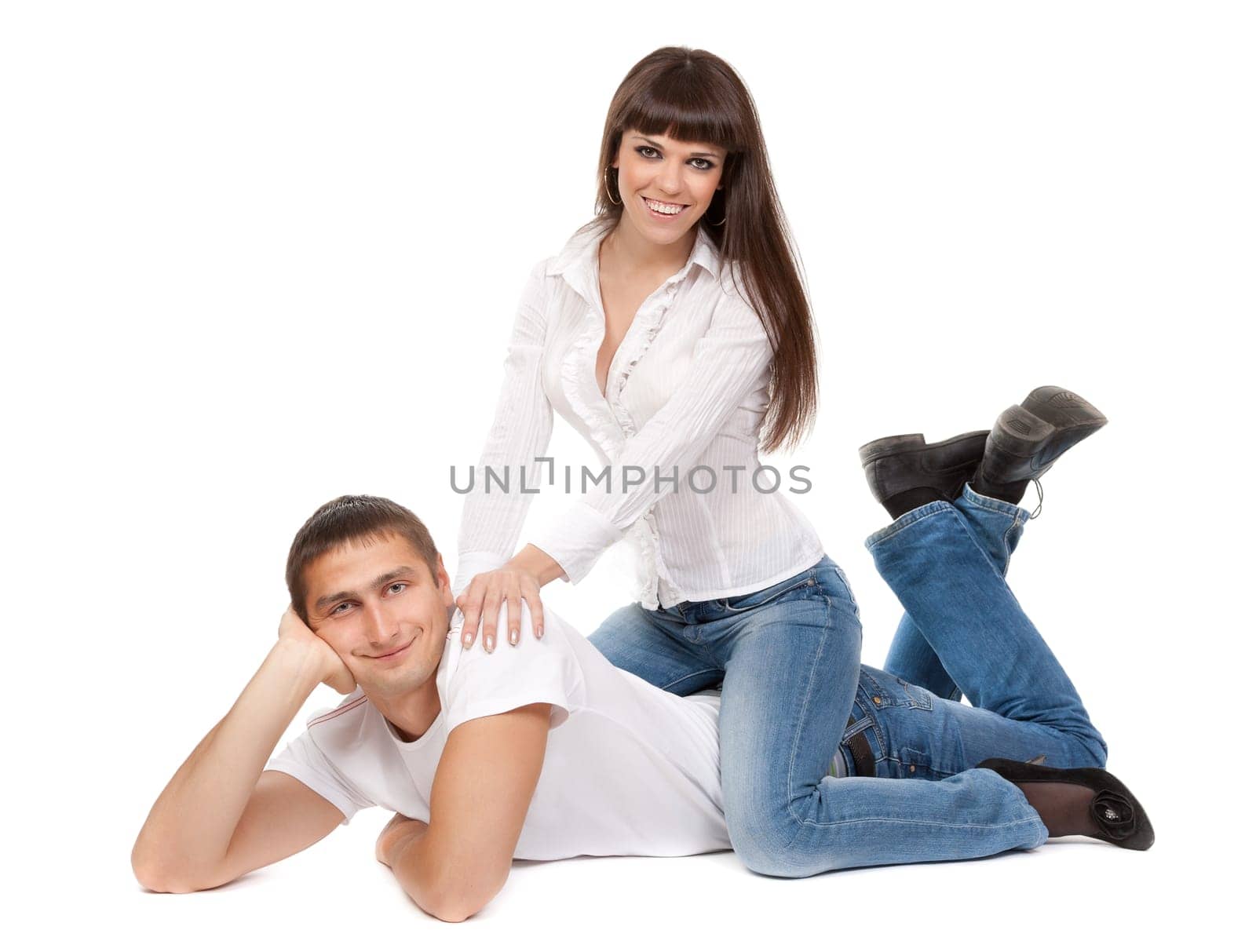 young couple lying on a white background