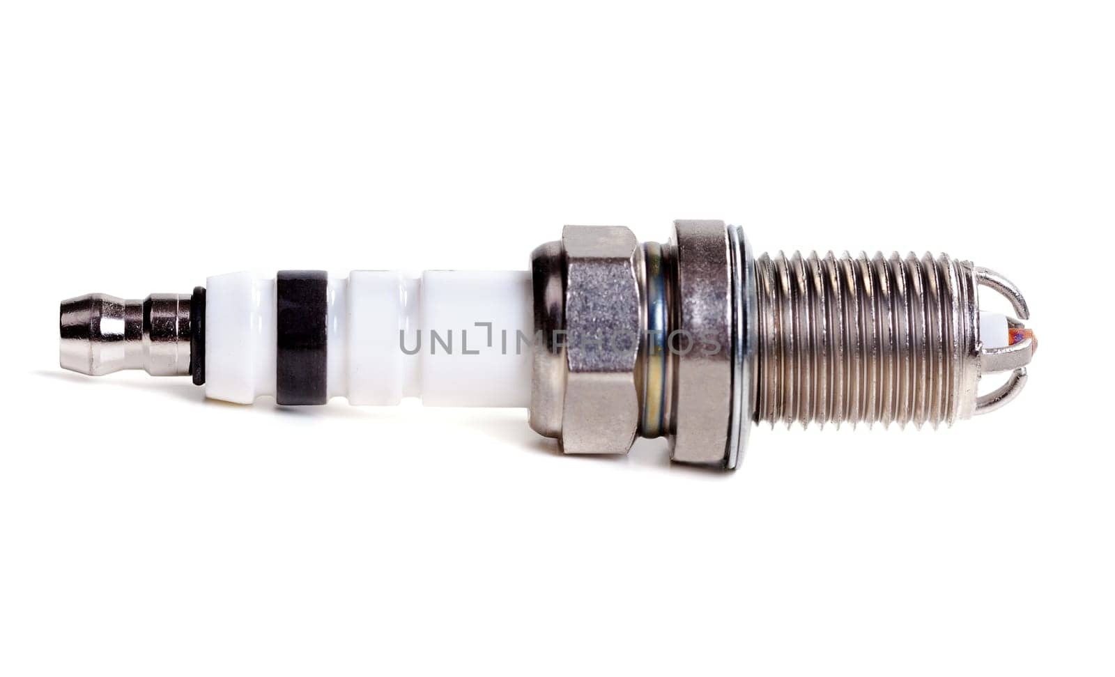 auto spark plug isolated on white background. Isolated sparking spark plug