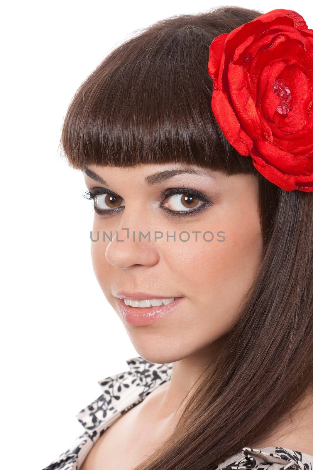 beautiful young brunette woman with an red fabric flower in her hair