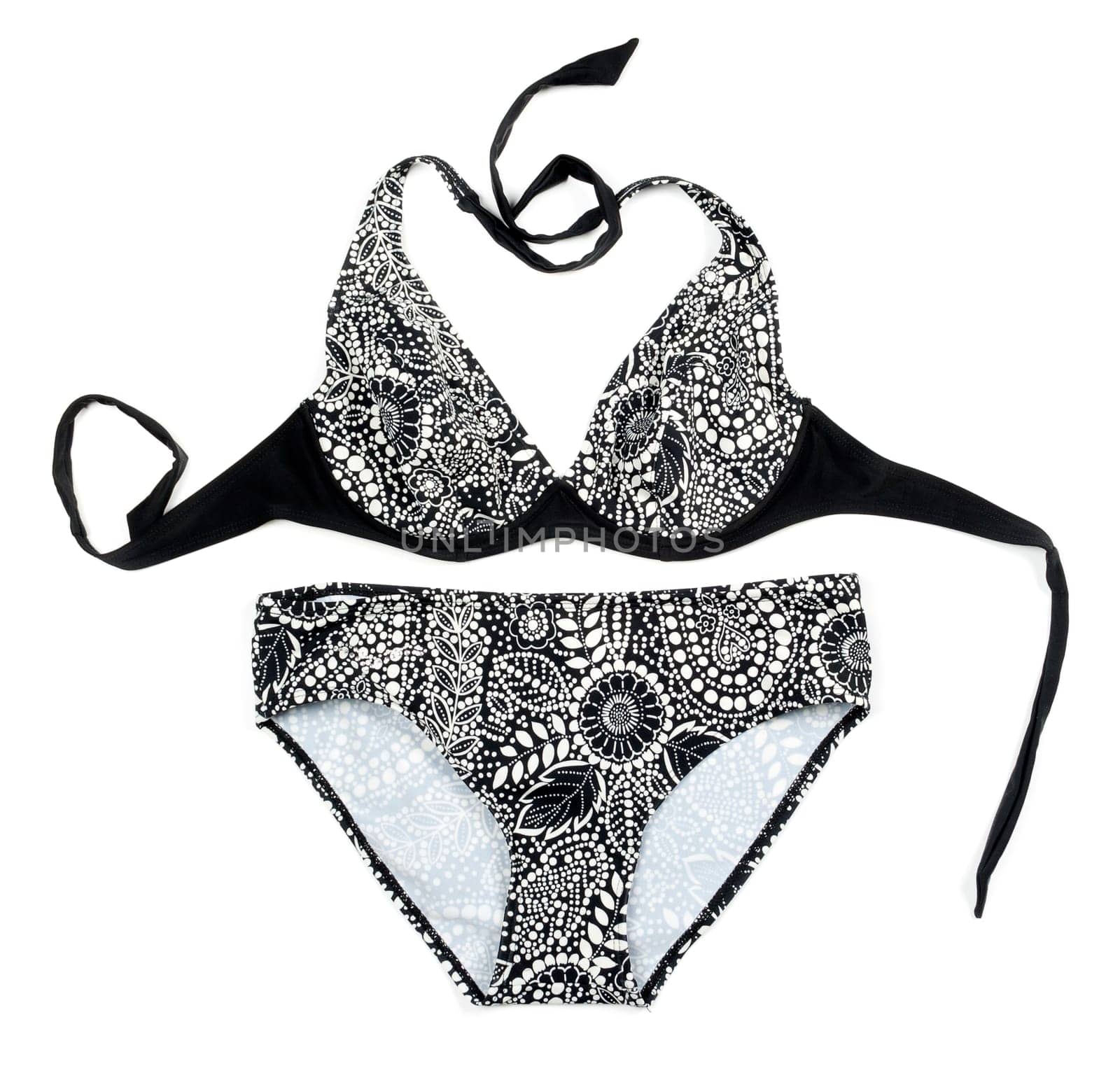 Black women's swimsuit with floral pattern. Isolated on white