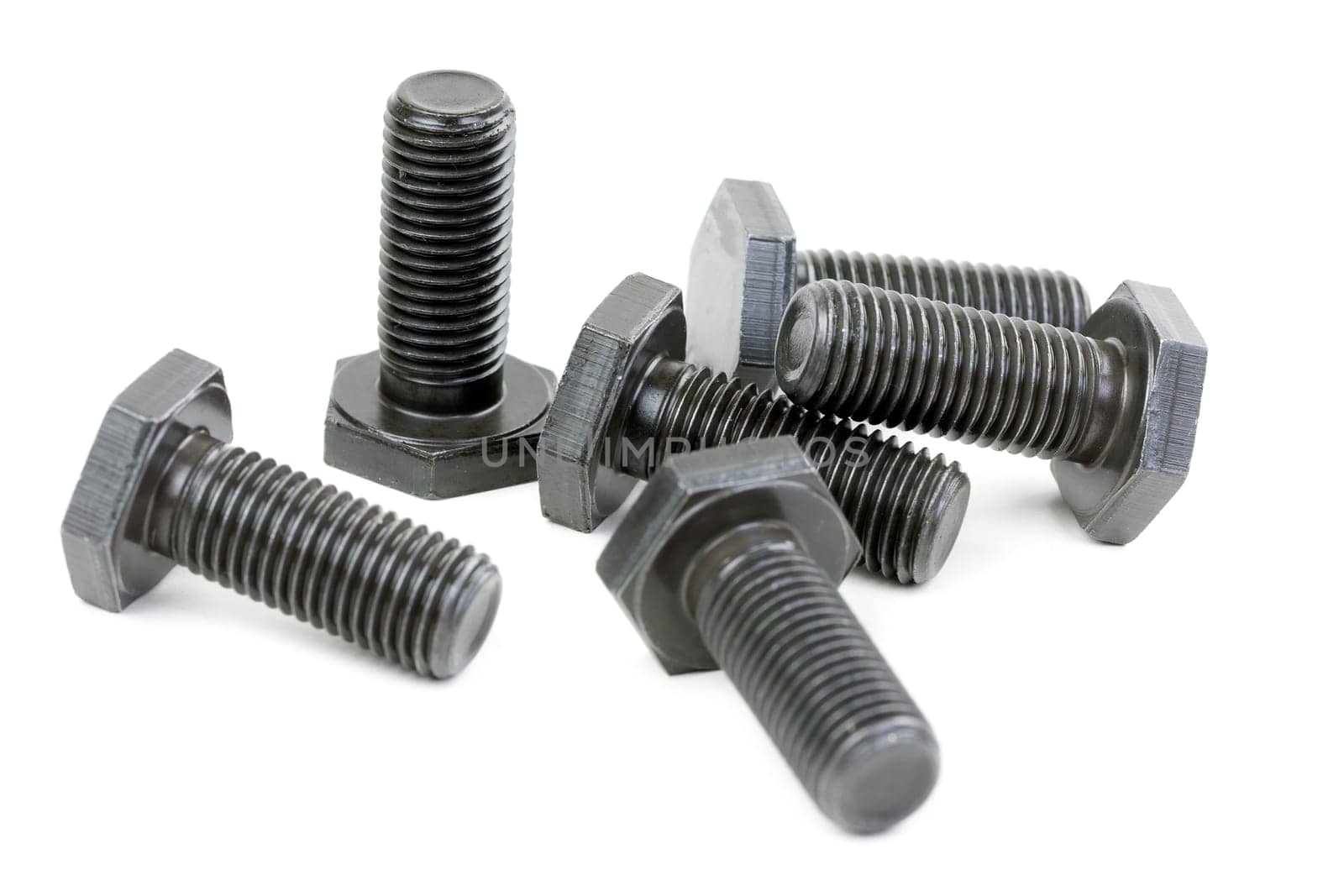 Bolts coated with protective varnish on a white background (heap)