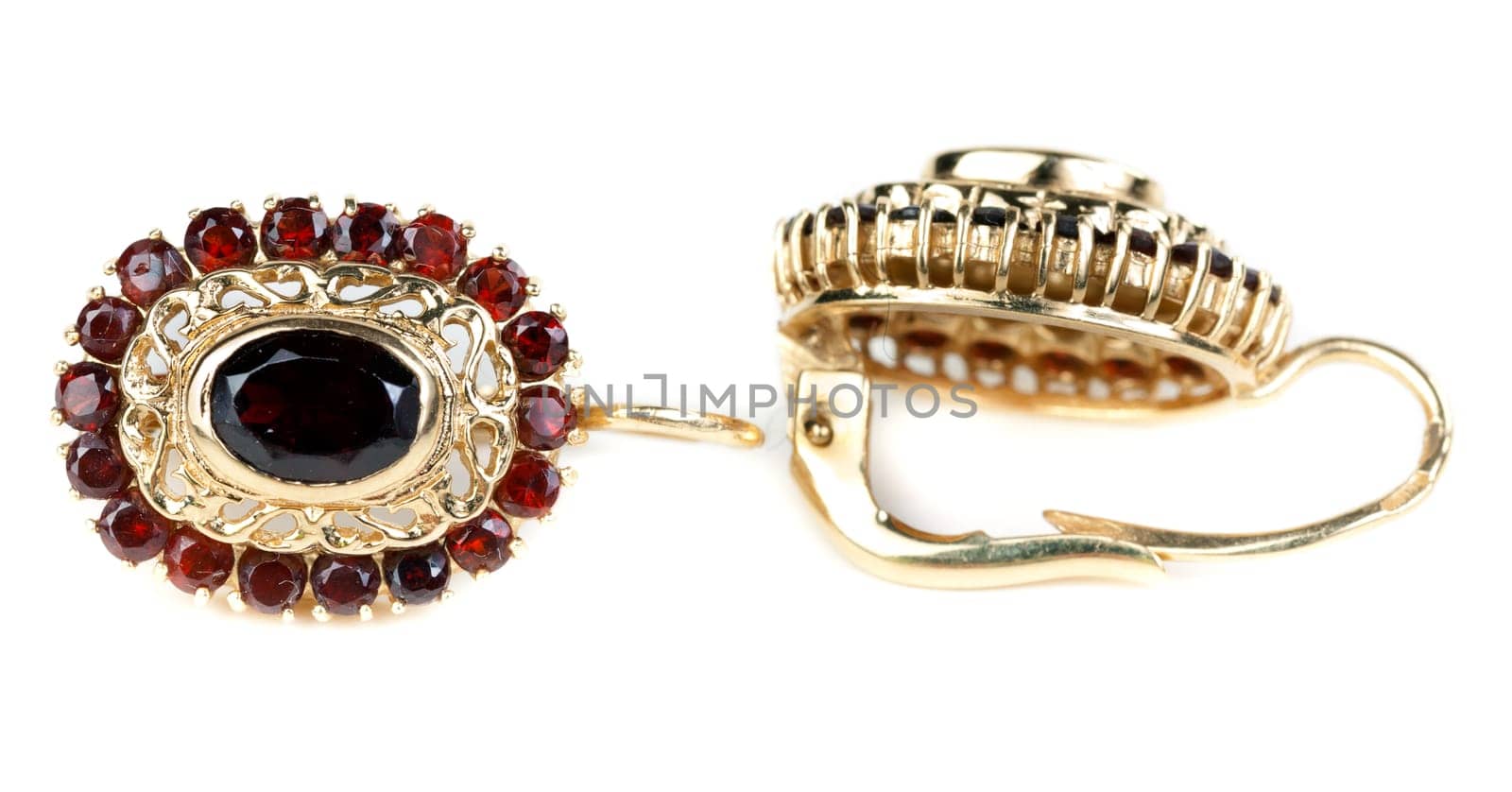gold earrings with ruby ​​isolated on white