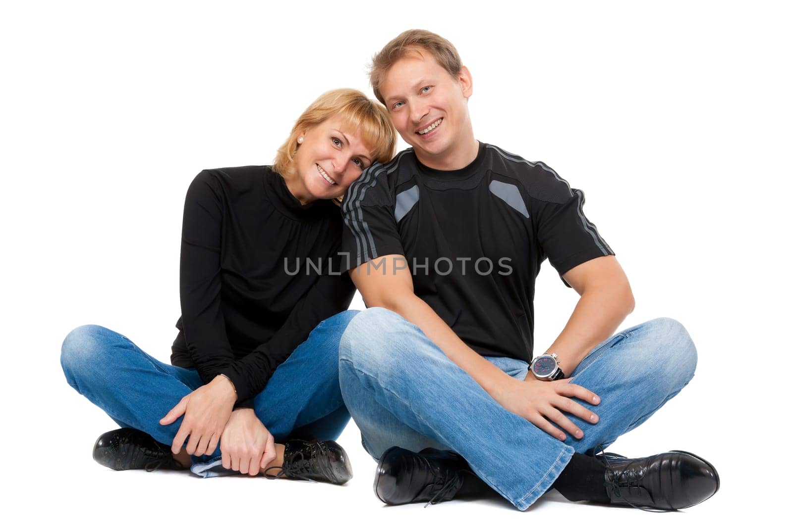 Beautiful couple in love sitting in the lotus position, isolate on white