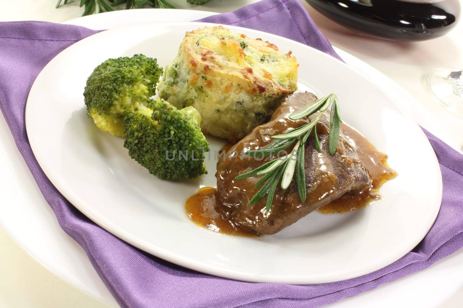 Venison steak with broccoli and potato gratin
