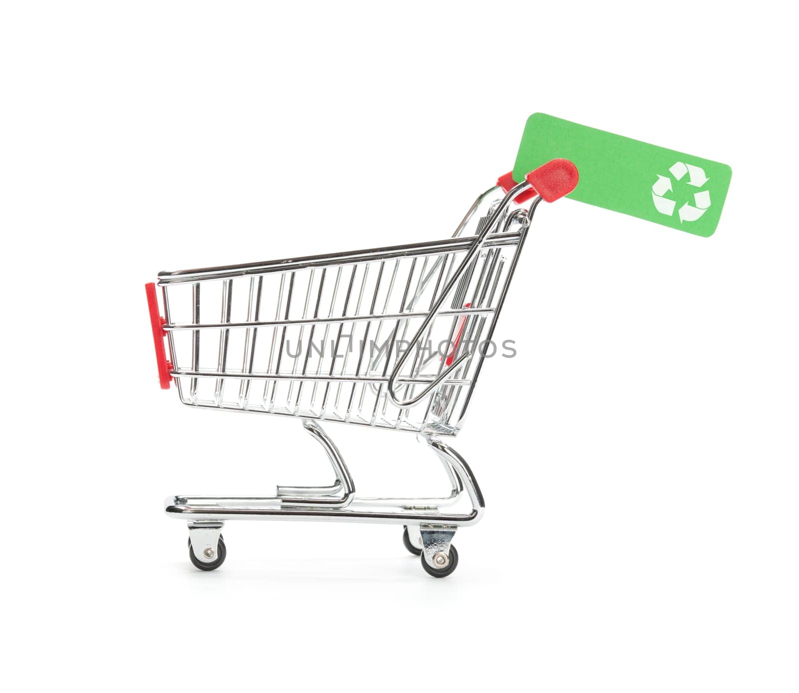 Green consumerism (bio, eco, recycling etc.) concept - shopping cart with green label with recycling sign.