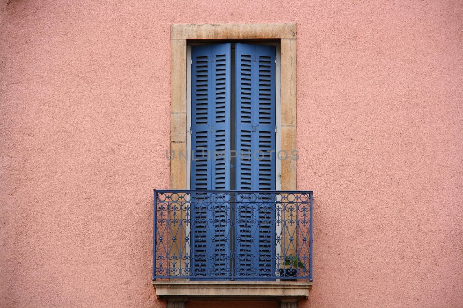 pink wall and blue balcony from old times