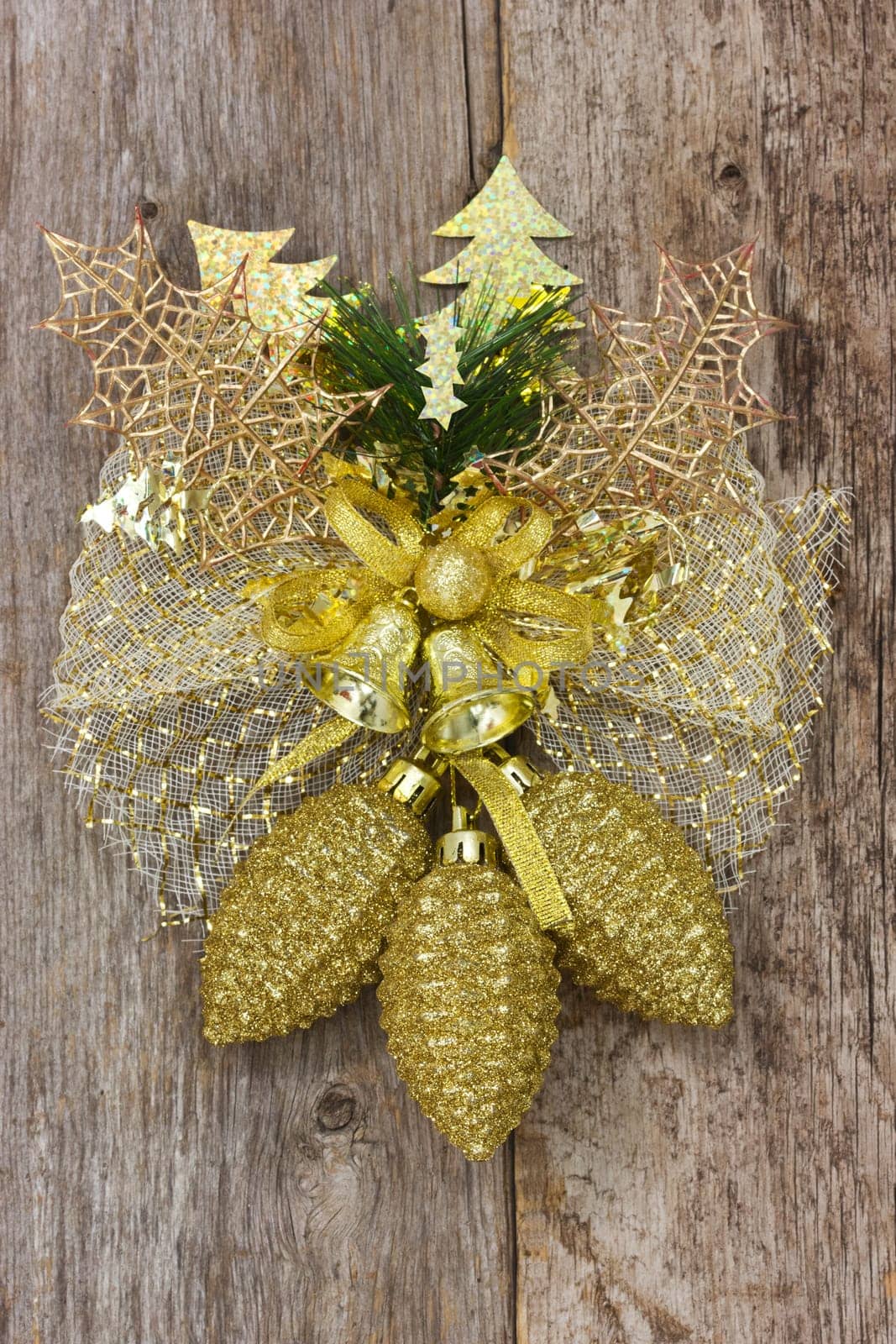 Golden christmas decoration hang on the wooden wall