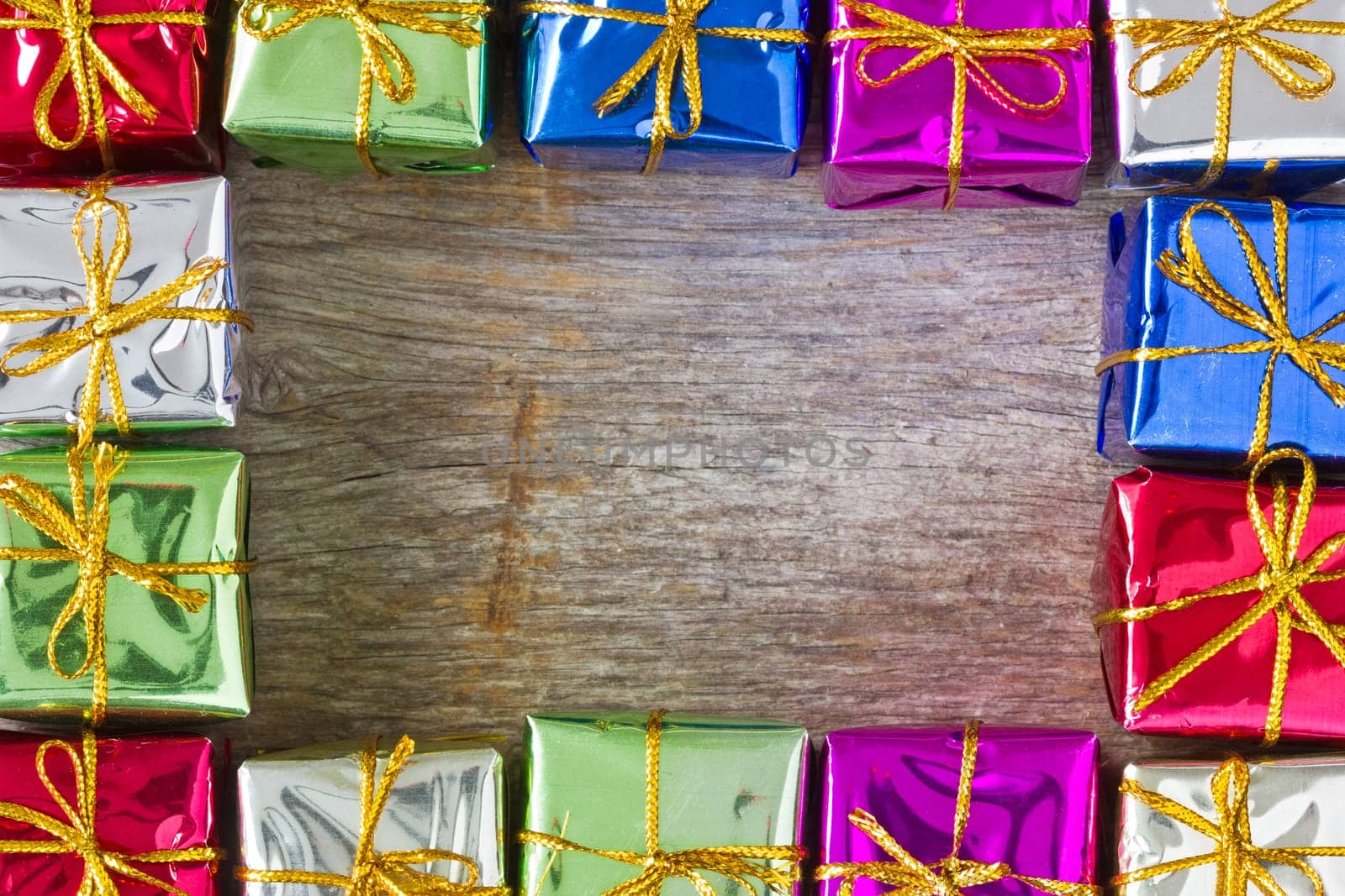 Frame made from many colorful glossy gift boxes