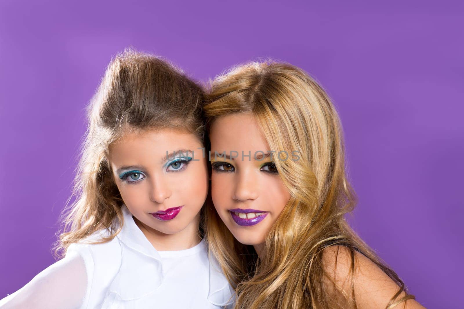 children two fashiondoll kid girls good friends with fashion makeup on purple
