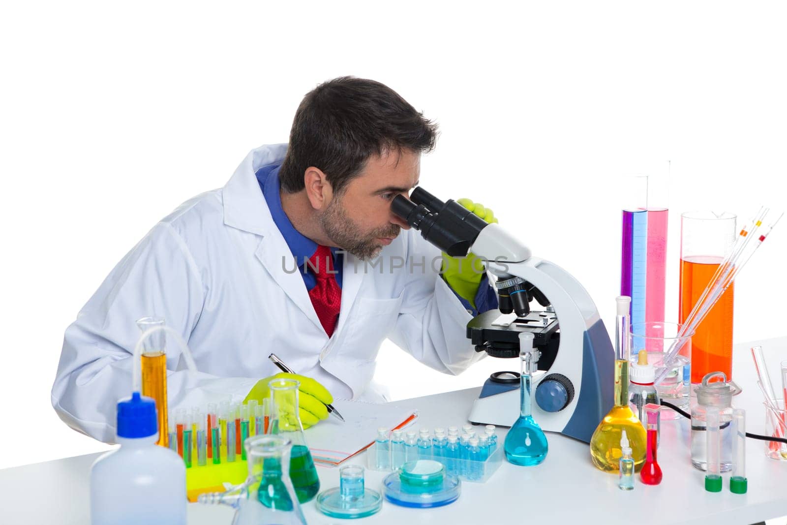 chemical laboratory scientist man looking at microscope on white desk