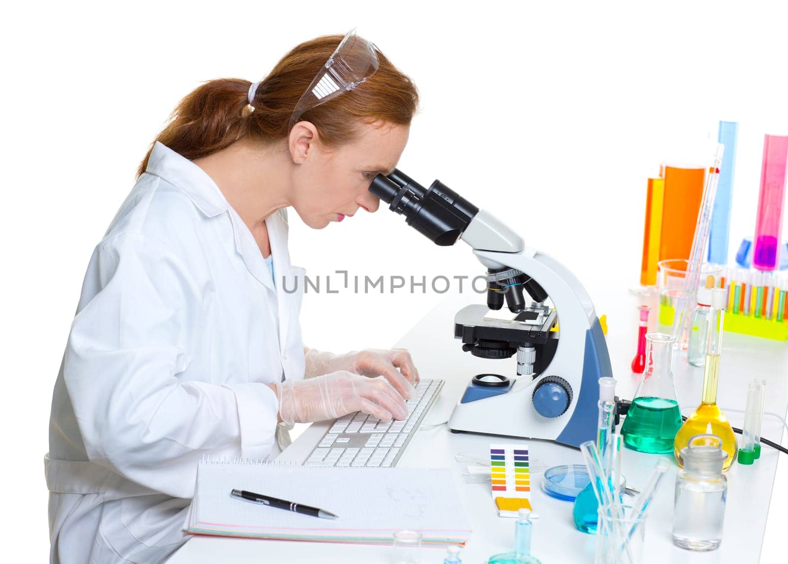 chemical laboratory scientist woman looking at microscope on white desk