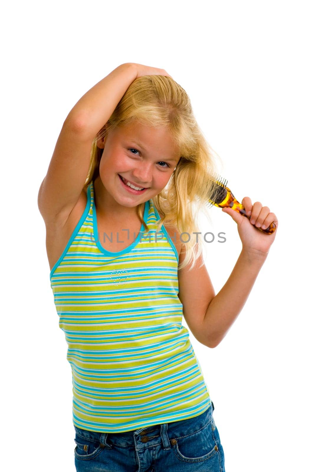 cute blond girl brushing her hair, isolated on white