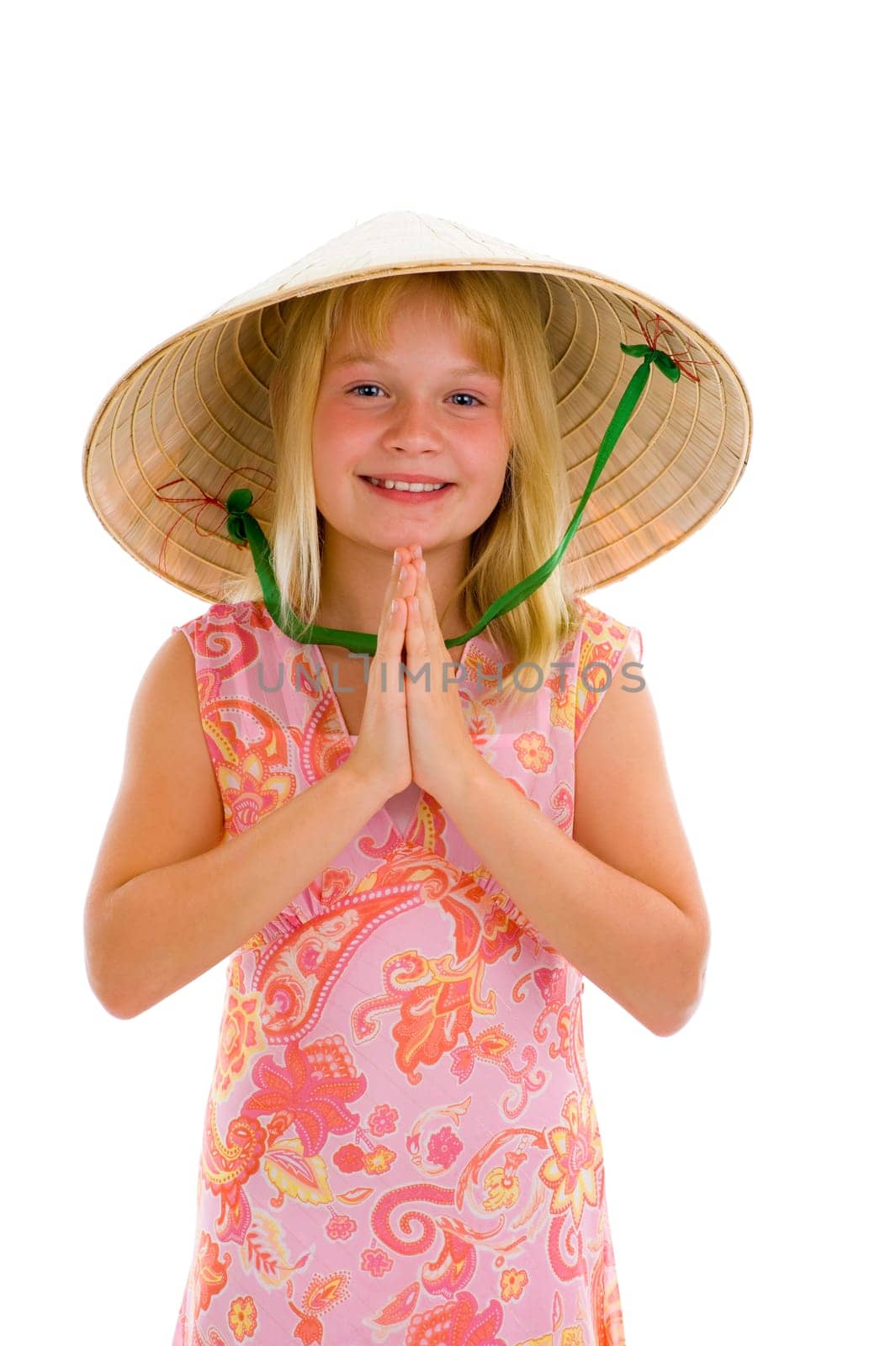 little schoolgirl with typical asian welcome expression, isolated on white