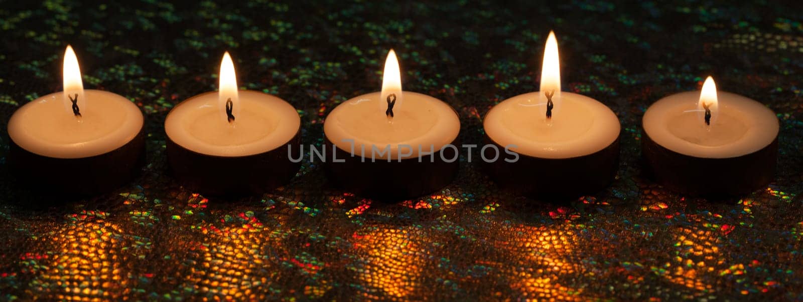 Burning candles on dark background