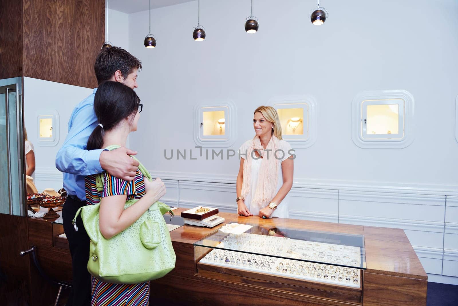 happy young romantic couple in love buy jewelry ring in luxury store
