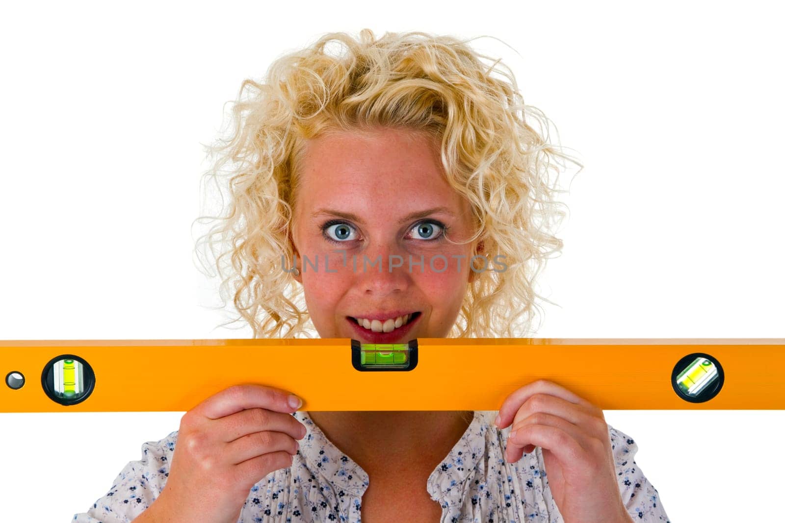 Attractive woman with spirit level isolated on white background