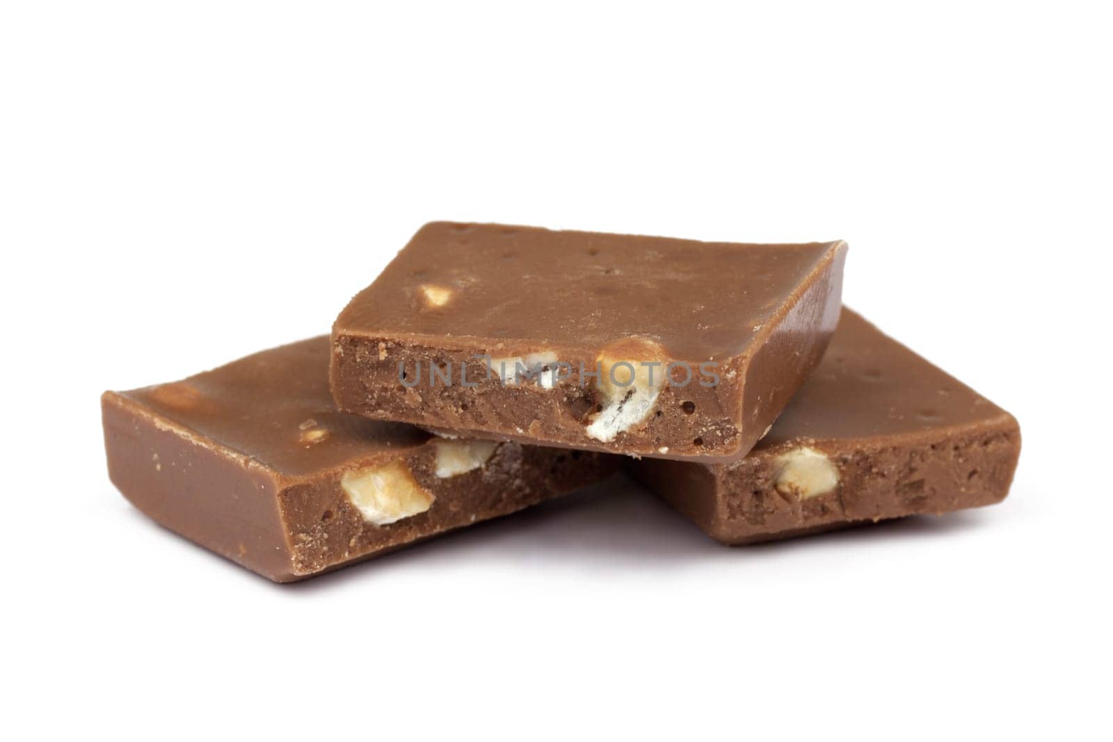 Chocolate,close-up of chocolate pieces against white background