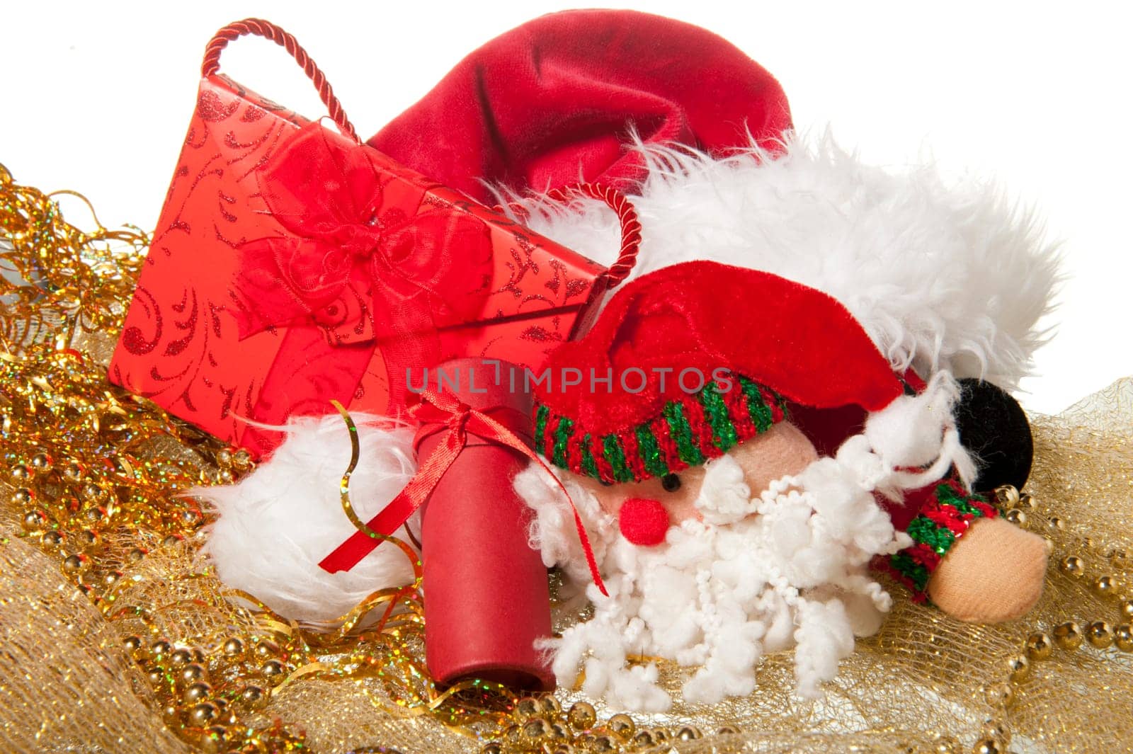 Santa Claus doll an christmas gift on a white background