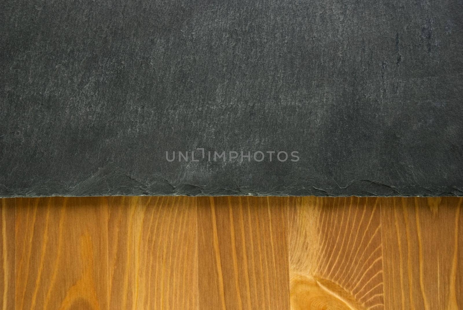 a slate and wooden background or texture, grey and brown