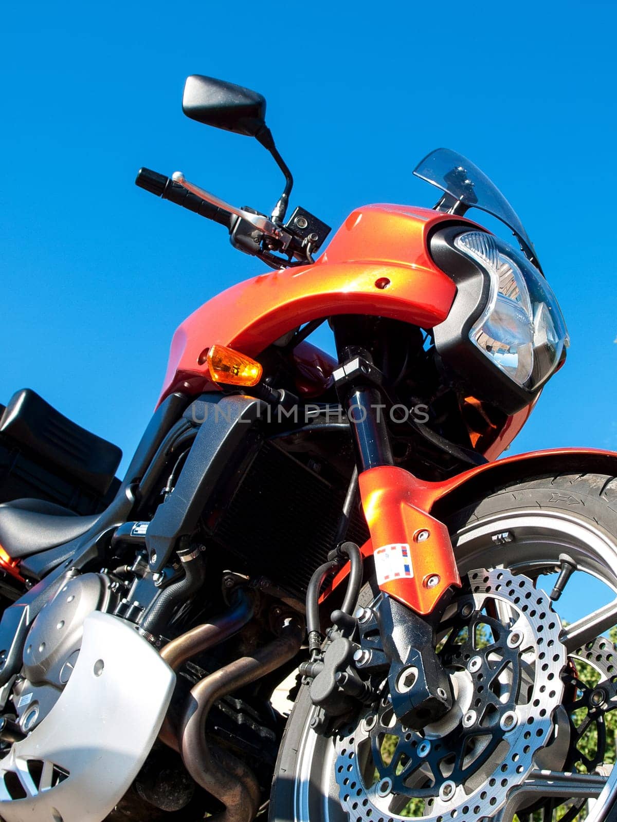 orange motorbike and a blue sky