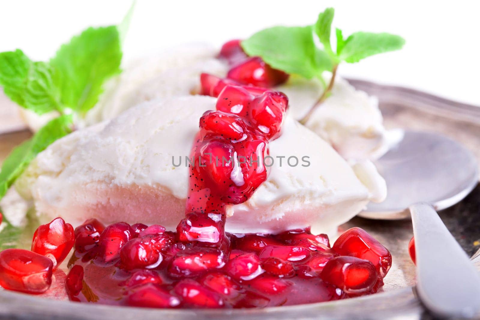 Vanilla ice cream with fruity red pomegranate