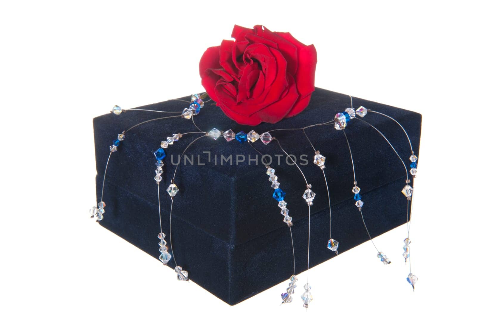 Gift box, pink and necklace on white background