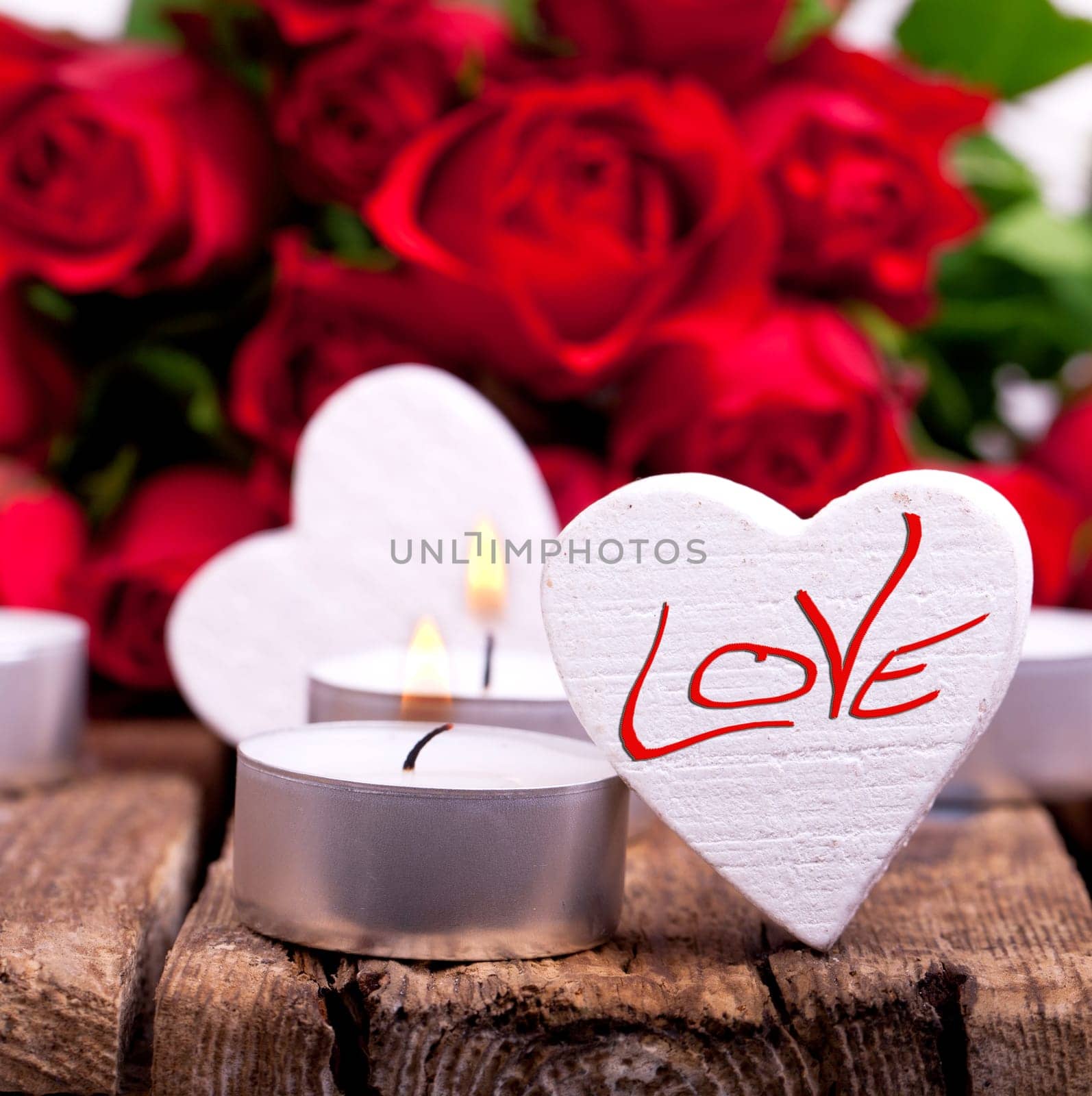 Wooden hearts with red roses