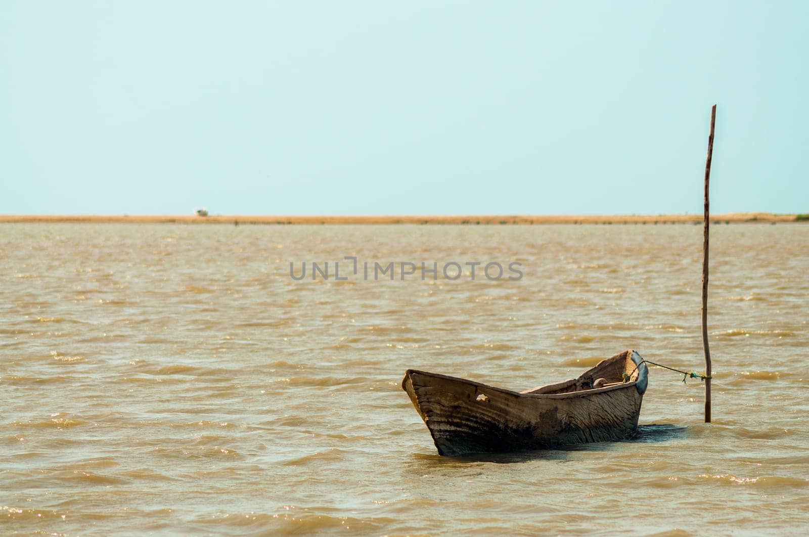 A lone canoe on a lagoon in La Guajira, Colombia