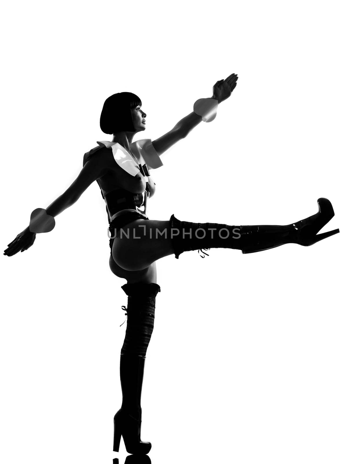 one sexy caucasian sexy woman dress as a maid or soldier walking parade silhouette in studio isolated on white background