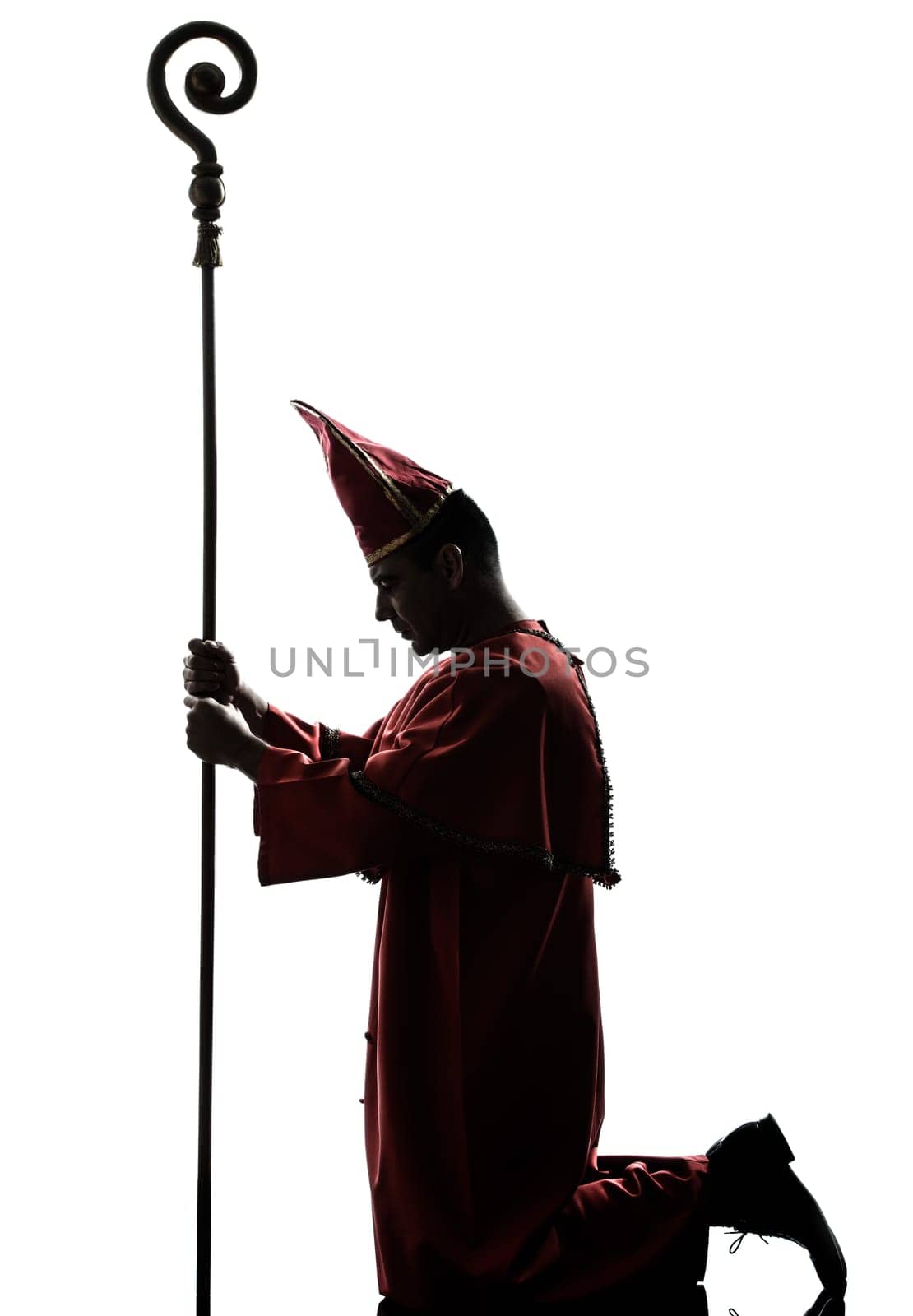 one man cardinal bishop silhouette in studio isolated on white background