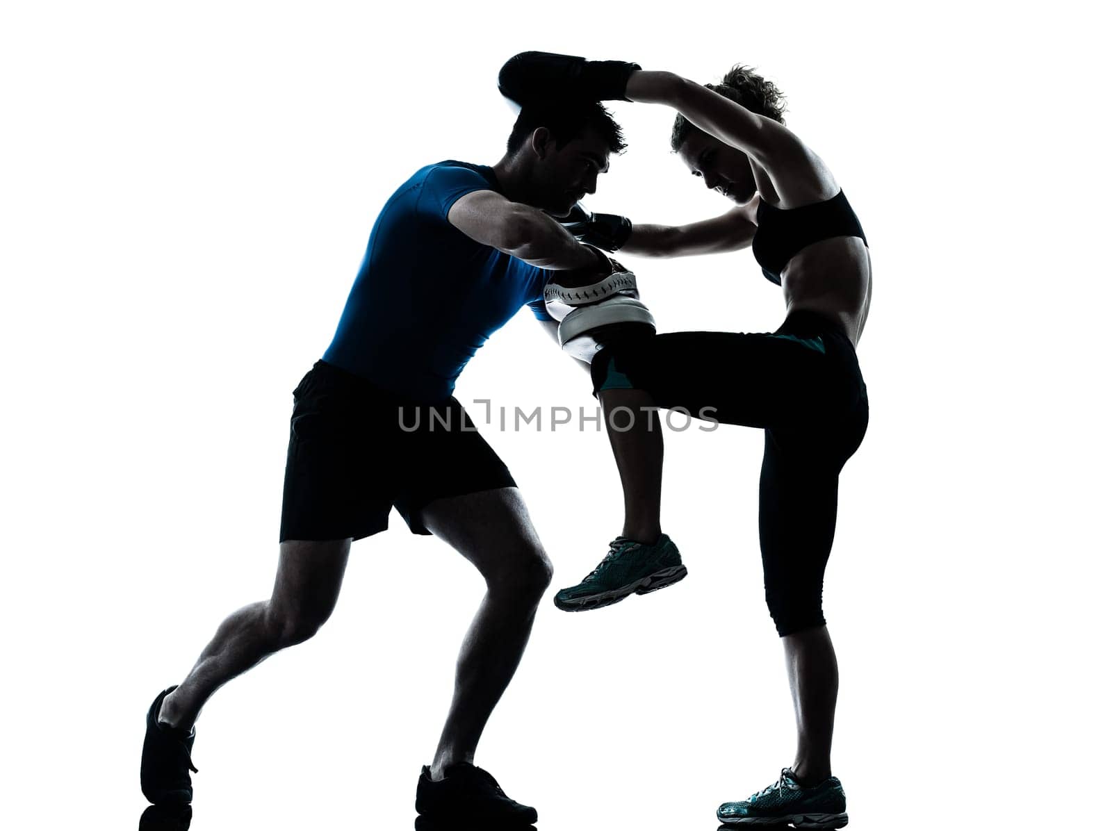 one caucasian couple man woman personal trainer coach man woman boxing training silhouette studio isolated on white background