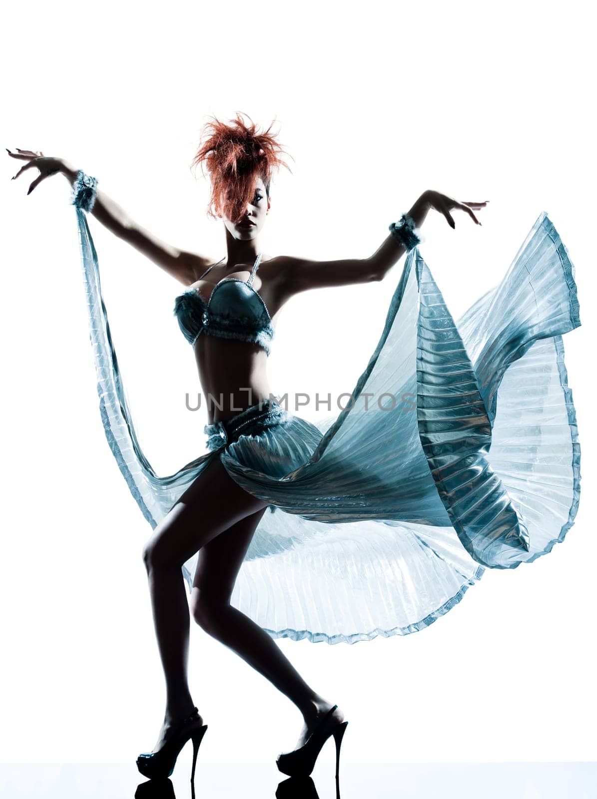 funky young woman with transparency silk dress in studio isolated on white background