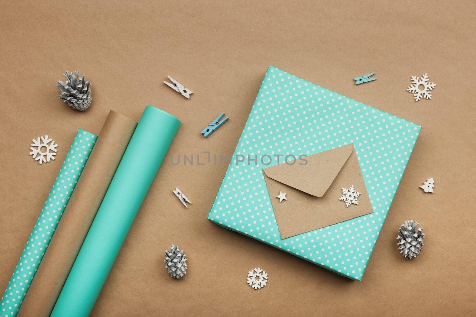 Packing Christmas gifts with blue paper by BreakingTheWalls