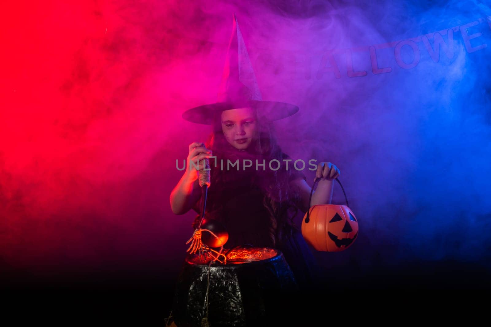 Little witch child cooking potion in the cauldron on Halloween. by Satura86